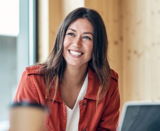 Woman smiling at desk