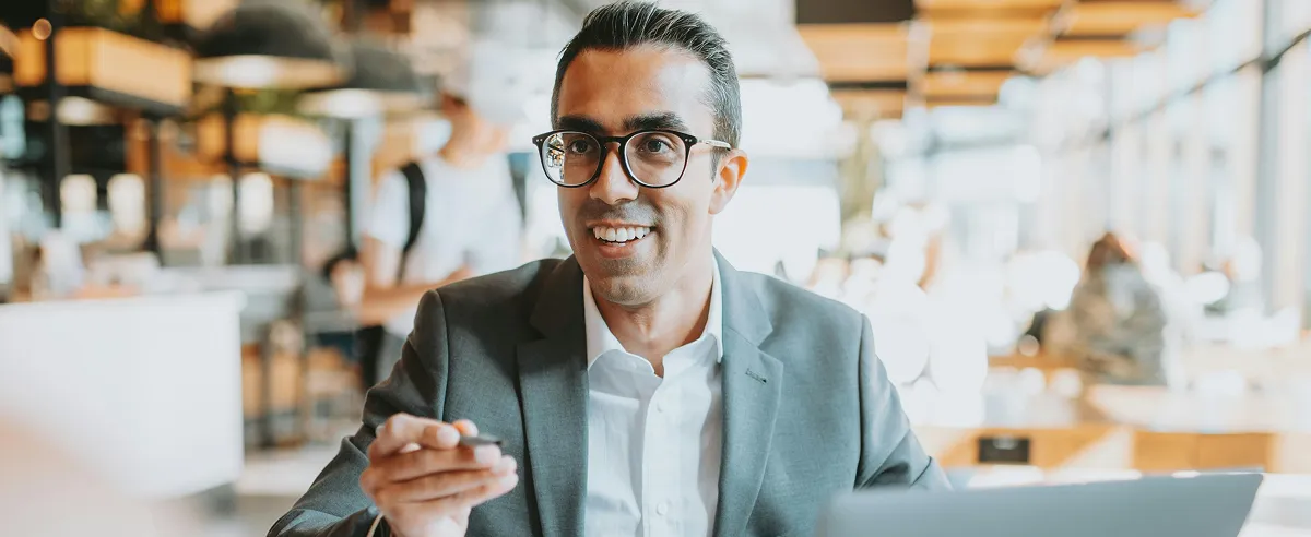 Man smiling in an office